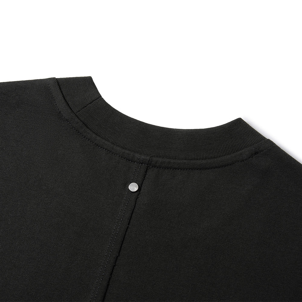 Close-up of a black crewneck sweatshirt showing the ribbed collar and a silver metal snap button closure on a white background.