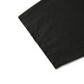 Close-up of a black fabric product corner with visible stitched hem detail on a white background.