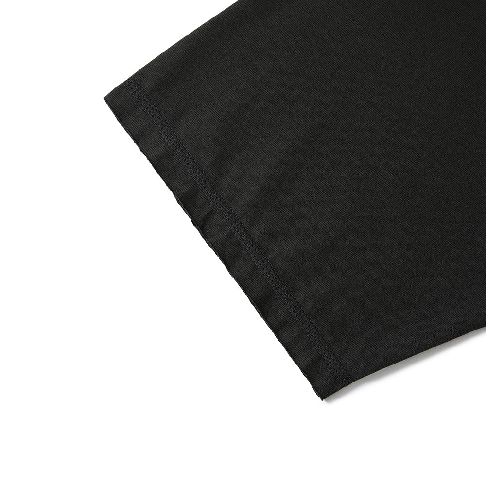 Close-up of a black fabric product corner with visible stitched hem detail on a white background.